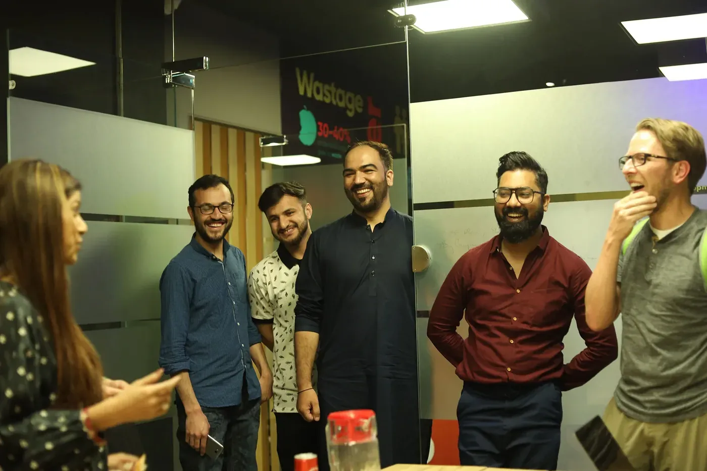 A group of Esipick team members standing together in an office